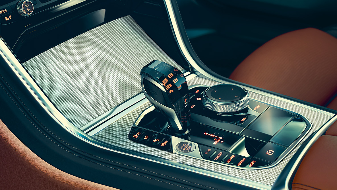 Skleněné prvky v interiéru BMW řady 8 Coupé. Detailní pohled na skleněné prvky v interiéru BMW řady 8 Coupé.