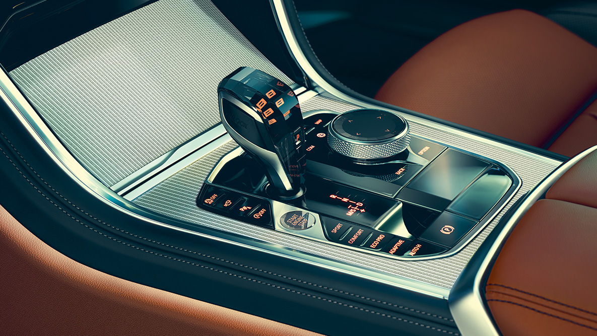 BMW řady 8 Coupé, středová konzola. Detailní pohled na interiér BMW řady 8 Coupé se zaměřením na středovou konzolu.