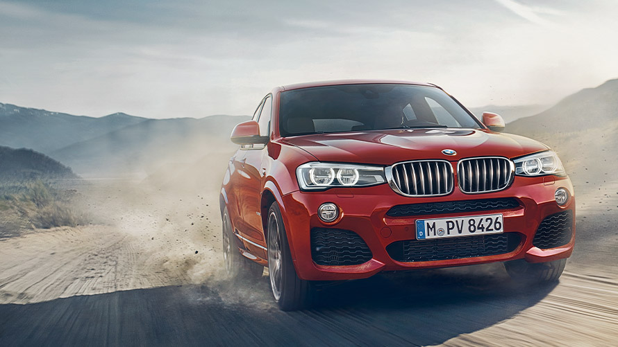 BMW X4 F26 první generace, jízdní tříčtvrteční záběr zepředu BMW řady X BMW X4 F26 první generace, jízdní tříčtvrteční záběr zepředu
